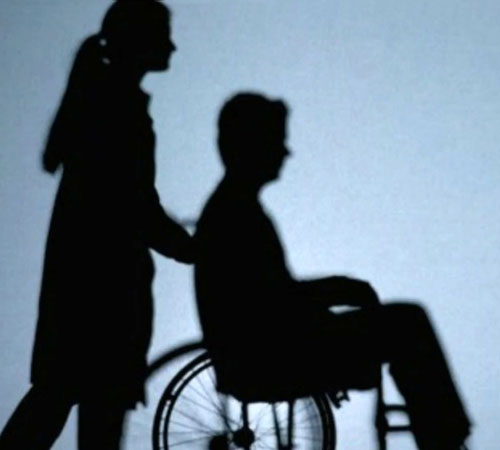 Caregiver pushing wheelchair